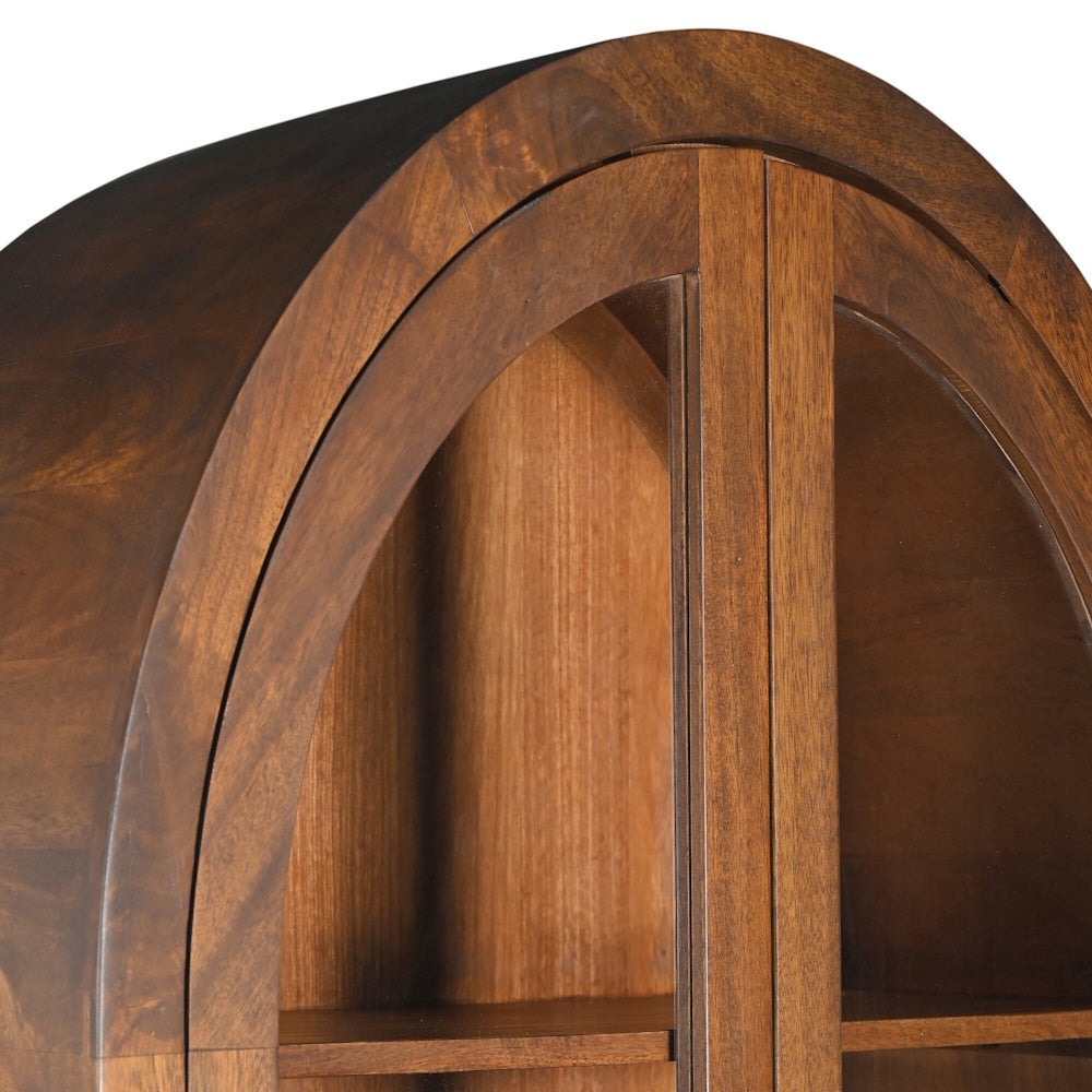 Close-up of an arched walnut wood display cabinet with glass doors and adjustable shelves.