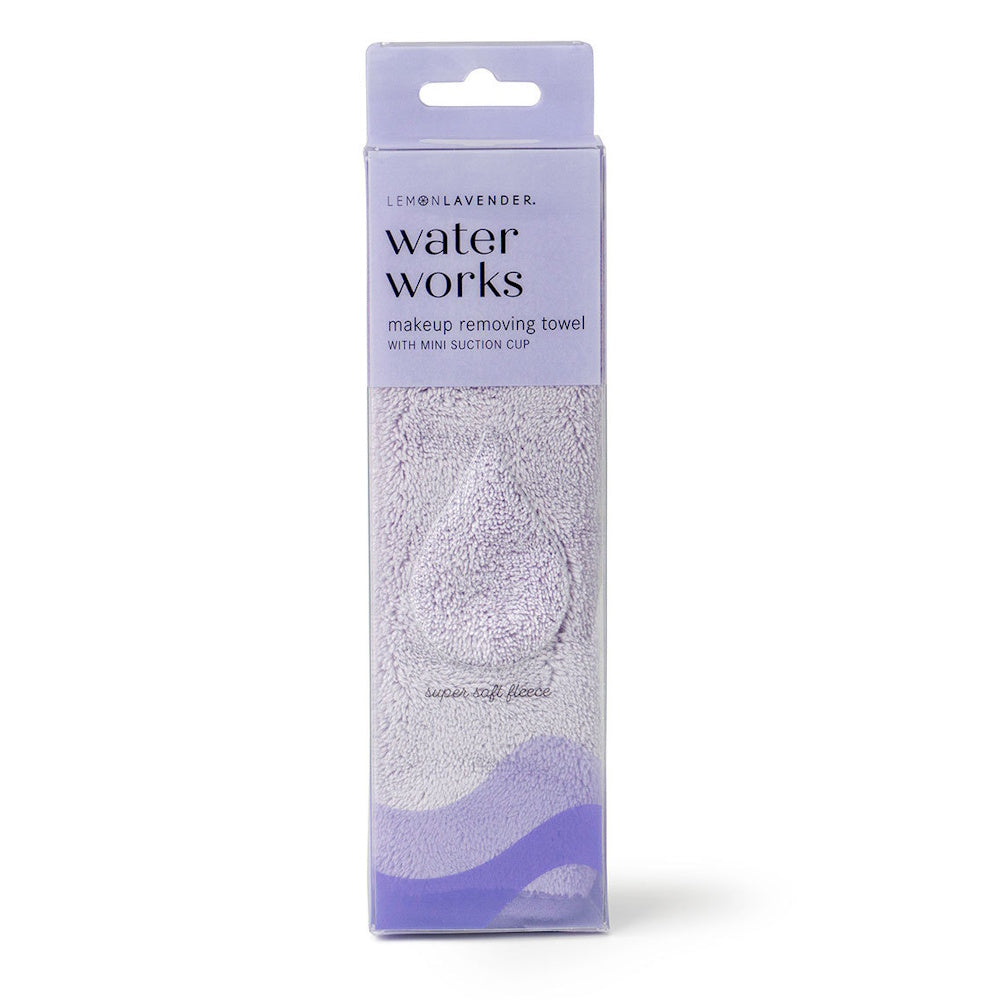 Purple Water Works makeup removing towel in a clear box, featuring soft fleece texture and a mini suction cup.