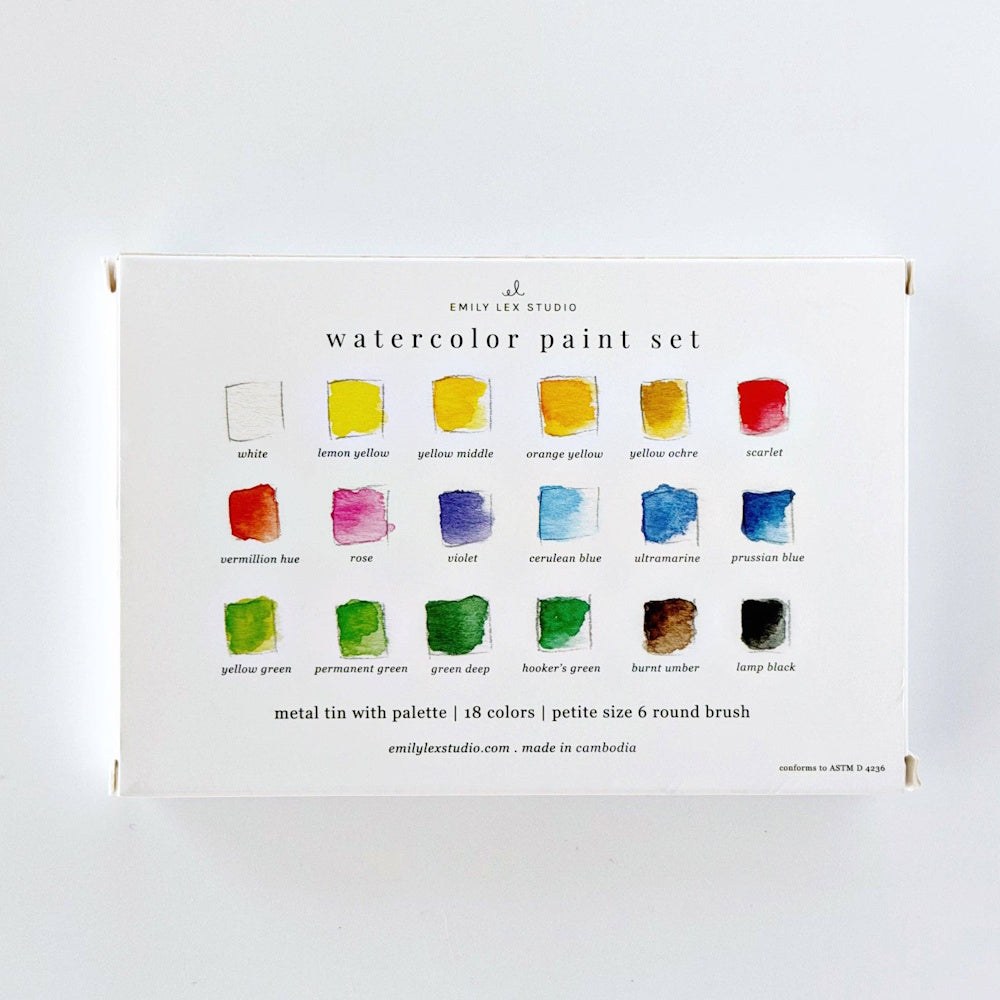 Back view of the outer packaging box for the Emily Lex Studio watercolor paint set, showing 18 color swatches with labels and product details.