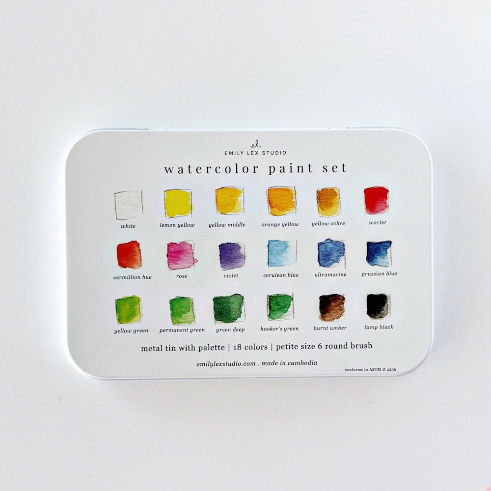 Back cover of the white Emily Lex Studio watercolor paint set tin featuring named color swatches, manufacturing details, and safety compliance info.