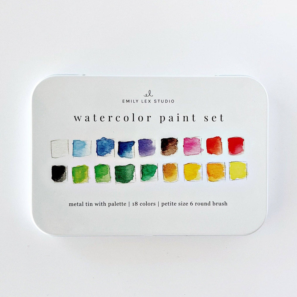 White Emily Lex Studio watercolor paint set tin featuring color swatches printed on the cover.