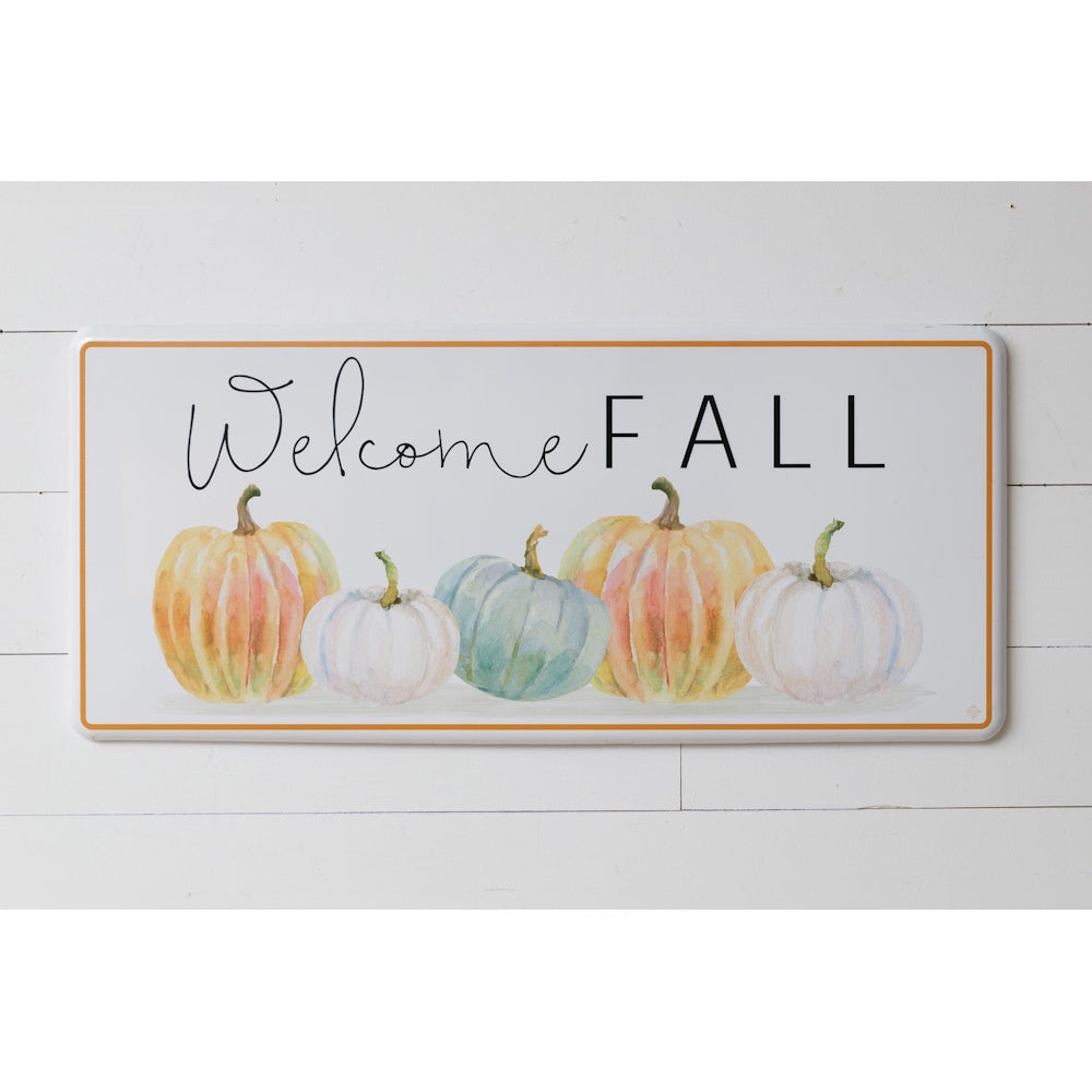 White metal sign reading "Welcome FALL" above watercolor orange, blue, and white pumpkins.