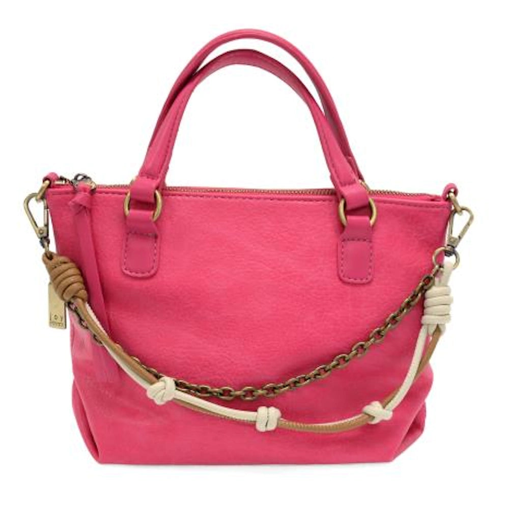 Hot pink mini tote bag with top handles and a decorative two-row knotted chain and cord accessory.