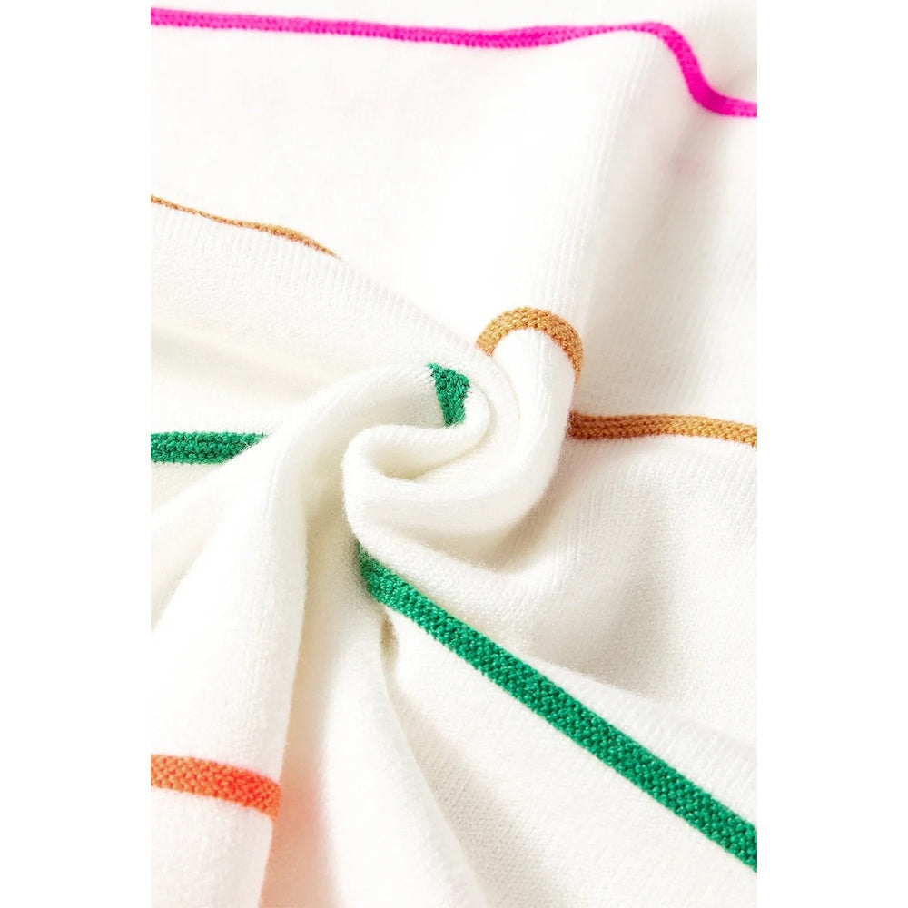 Close-up of a white knit fabric with thin, colorful horizontal stripes in pink, orange, green, and gold.