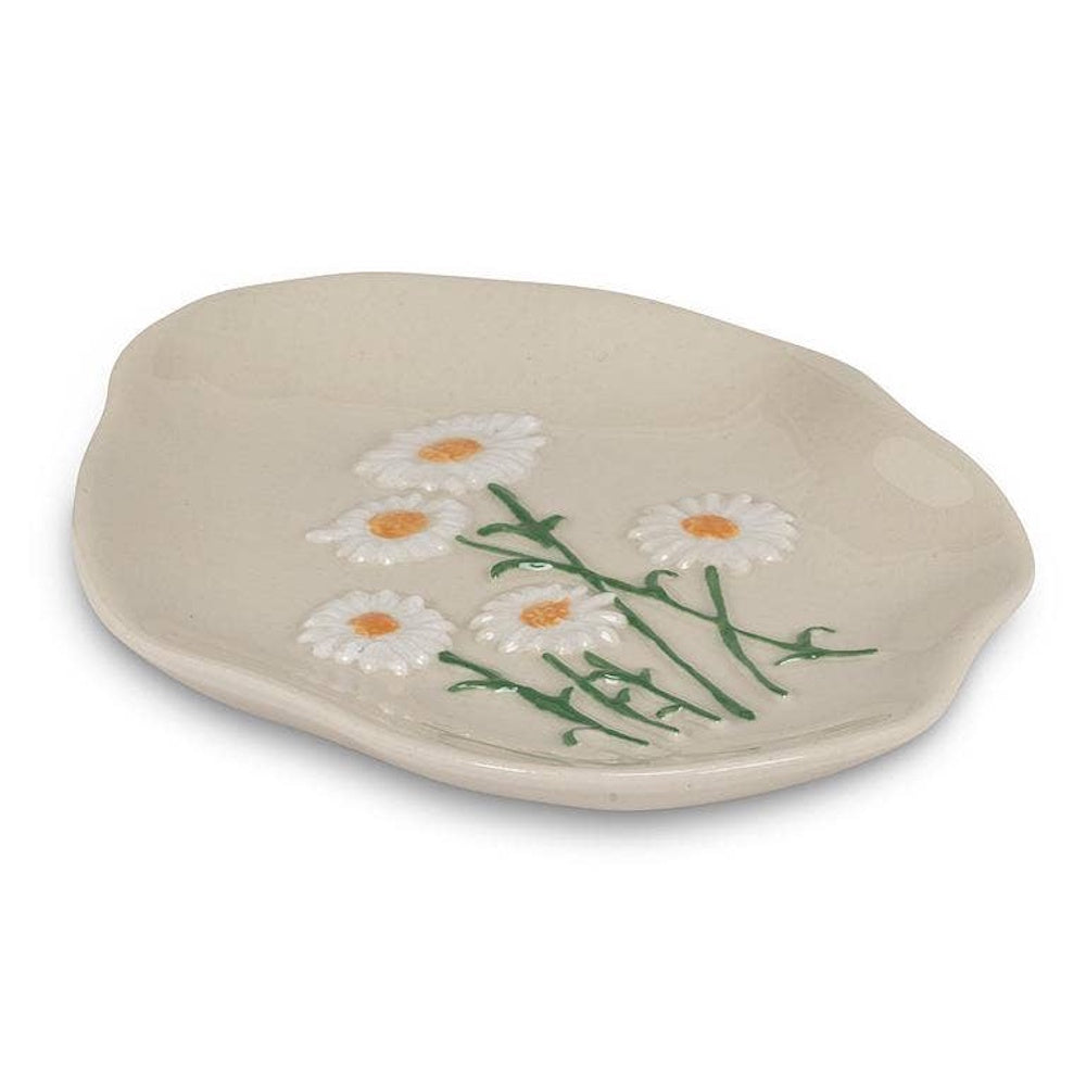 Off-white ceramic dish featuring raised white daisy flowers with green stems.