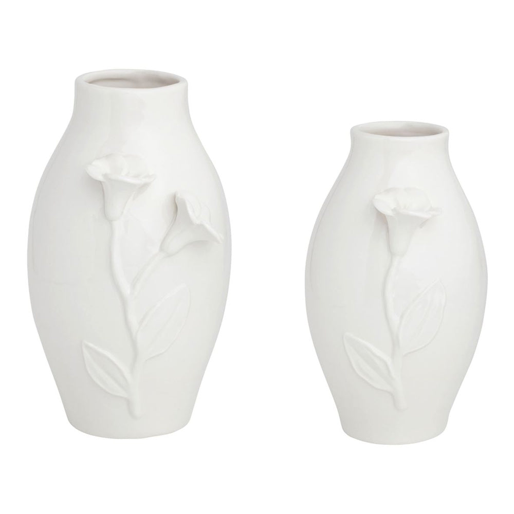 Two white ceramic vases with embossed floral designs of stems and lilies on a plain white background.