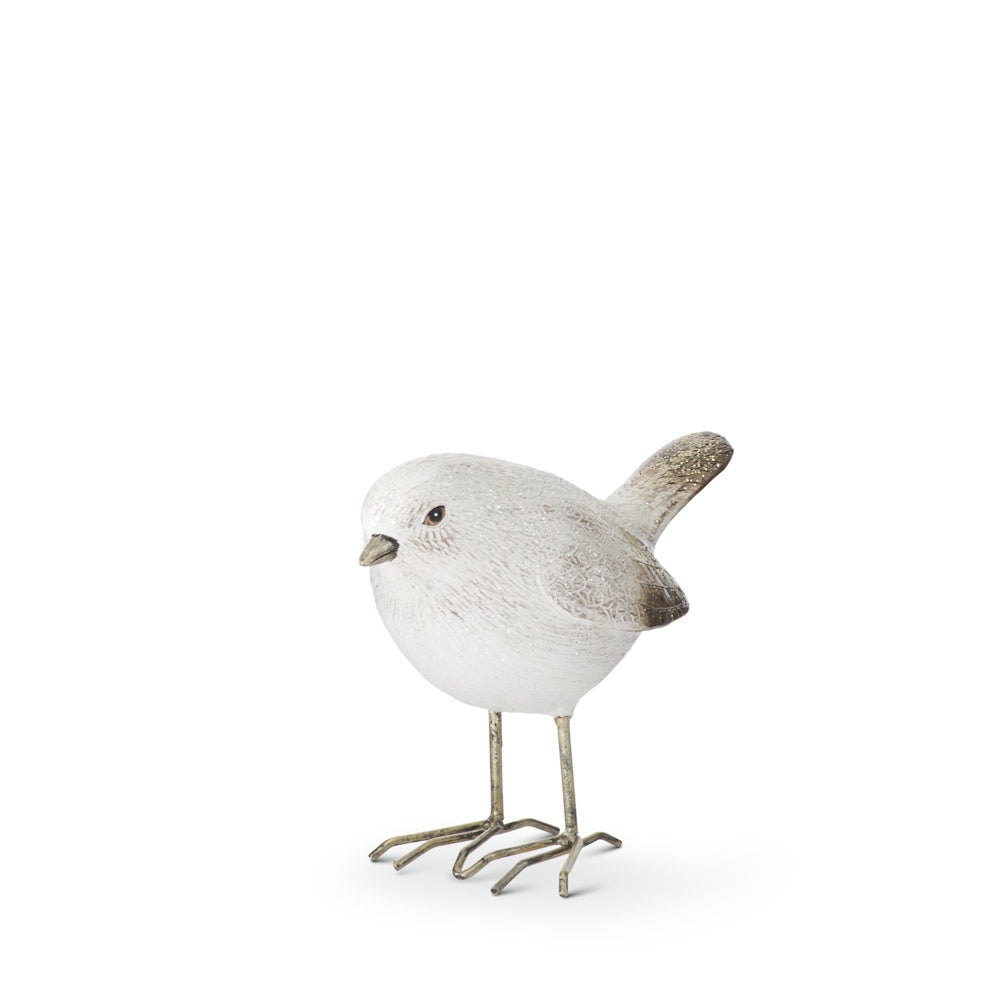 White and gold glittered bird figurine with its head down, standing on thin metal legs against white.