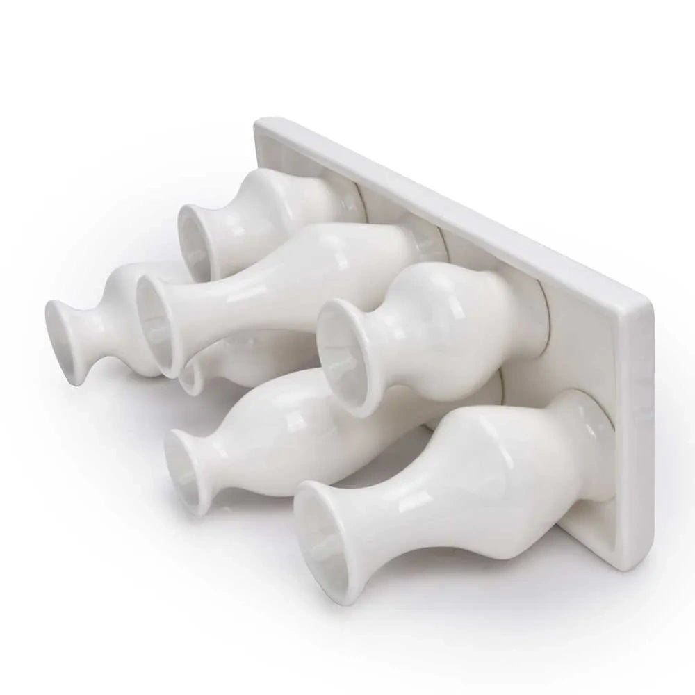 White ceramic bud vase set shown from a bottom-angled view highlighting the tray base.