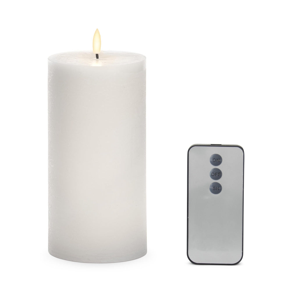 White LED wax pillar candle with a glowing flame and a grey remote control featuring on, off, and 5H timer buttons.