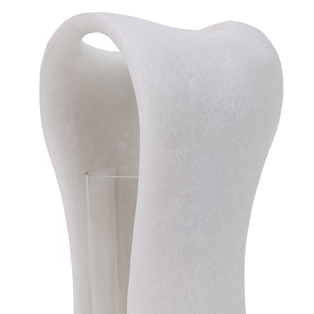 Close-up of a white Lestro marble hurricane candle holder featuring a sculpted, organic top and clear glass insert.