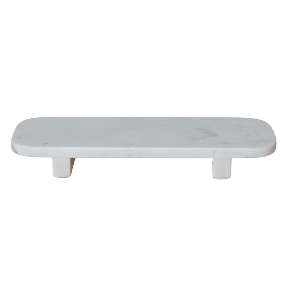 A rectangular white marble pedestal riser with rounded corners and four short, square legs.