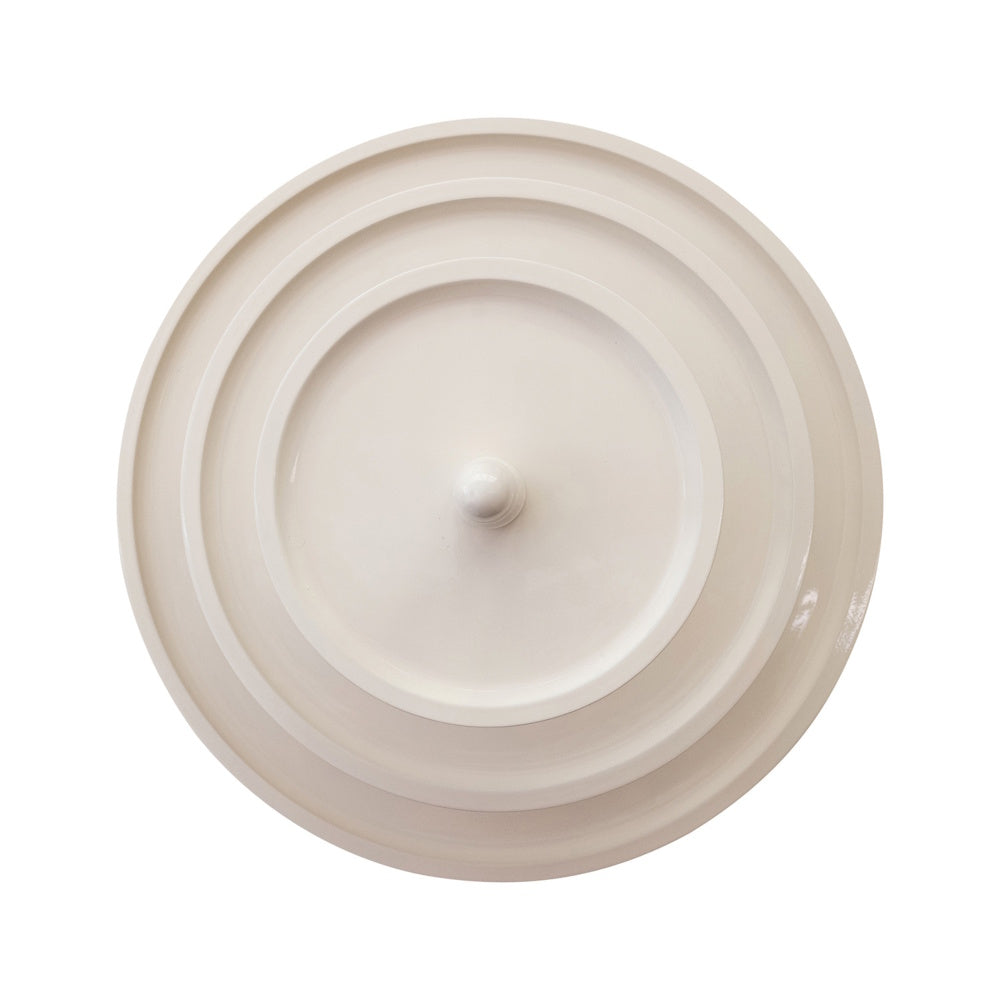 Top-down view of a round, white lacquered three-tier serving tray with a central knob on a white background.