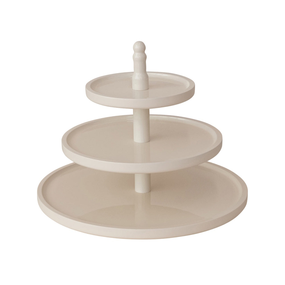 Three-tier off-white lacquered serving tray with round rimmed platters stacked on a central spindle.