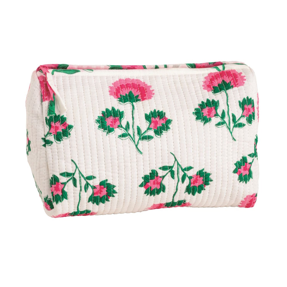 White quilted block print cosmetic bag with pink floral pattern and zipper.