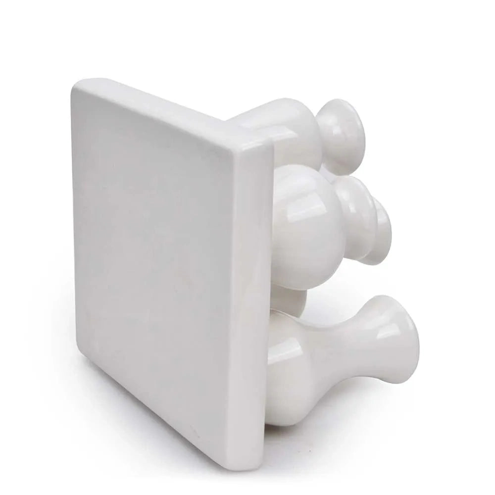 Bottom-up view of a white ceramic bud vase set showcasing the flat tray base.