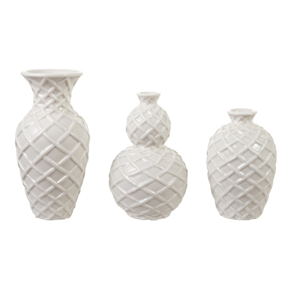 Set of three white ceramic vases in varying shapes with textured basket-weave patterns.