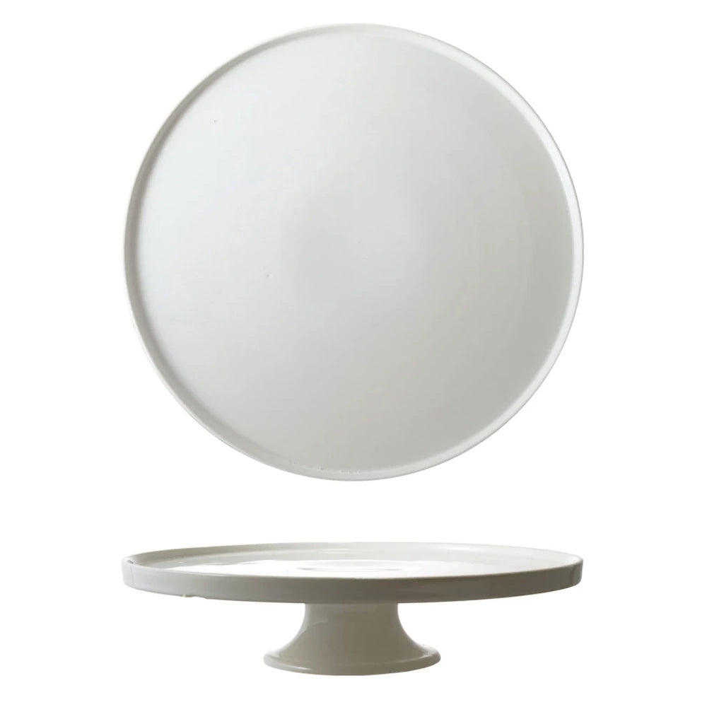 Minimalist white stoneware cake stand shown from top and side views against a clean white background.