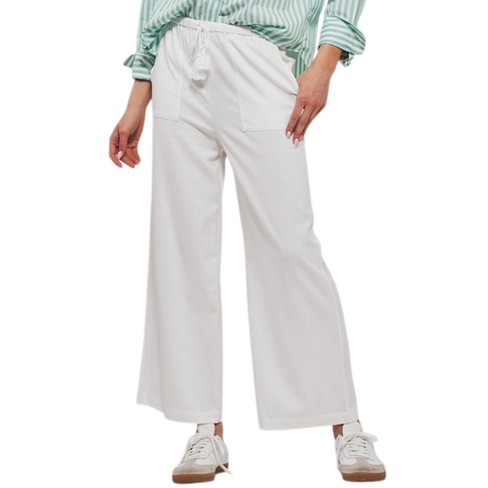 White wide-leg linen pants with a tassel drawstring waistband, paired with a striped shirt and white sneakers.