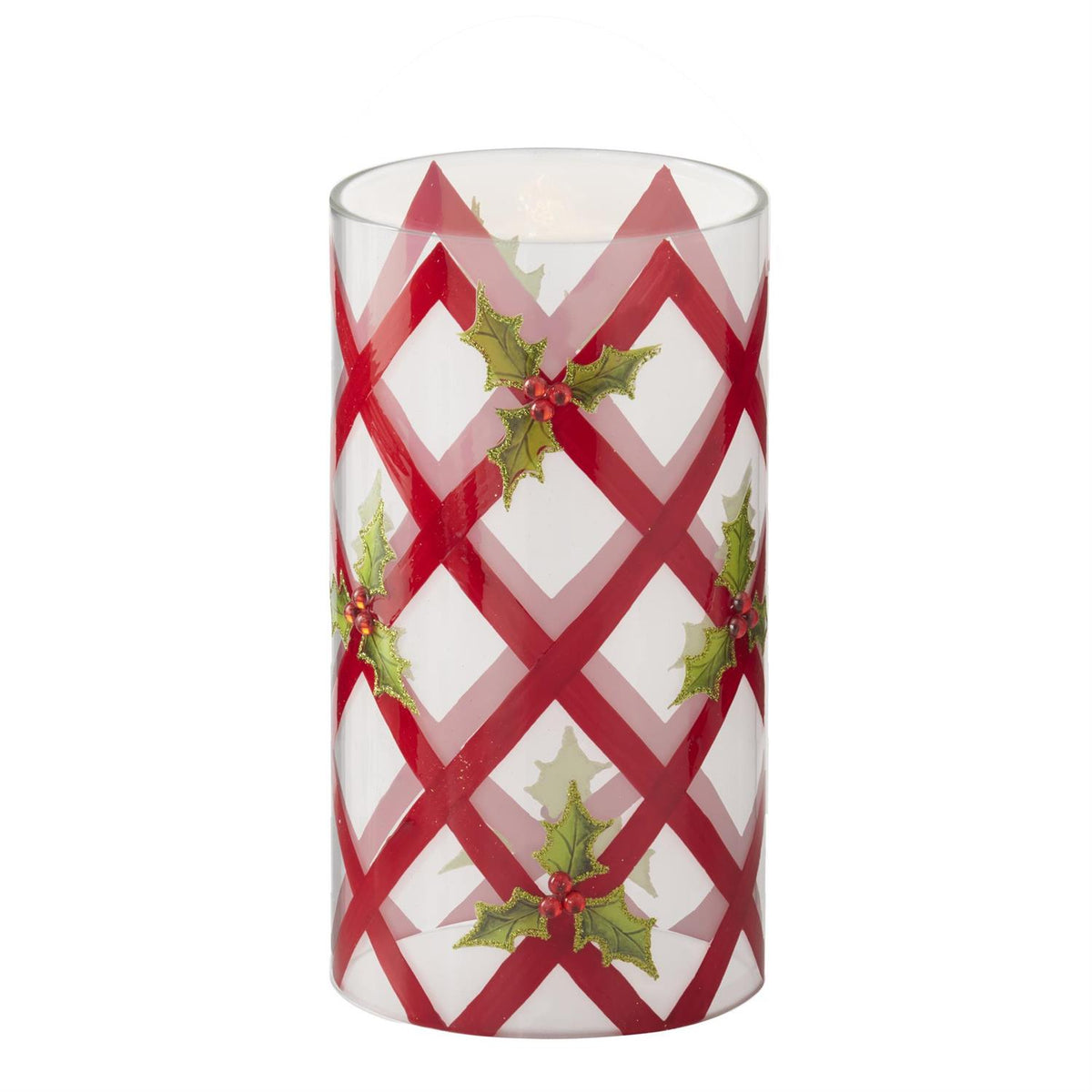 White candle slip cover with red criss-cross lines and holly.