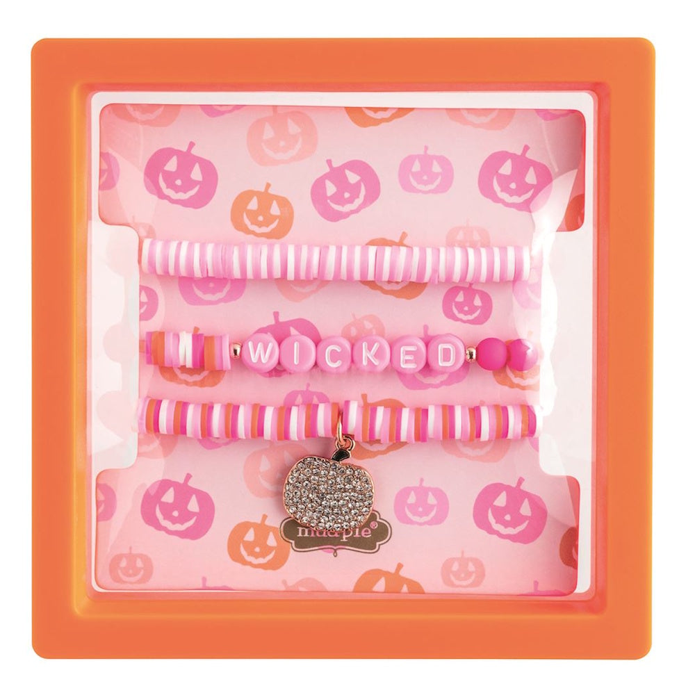 Mud Pie pink and orange Halloween bracelet set with "WICKED" letters and pumpkin charm in box.
