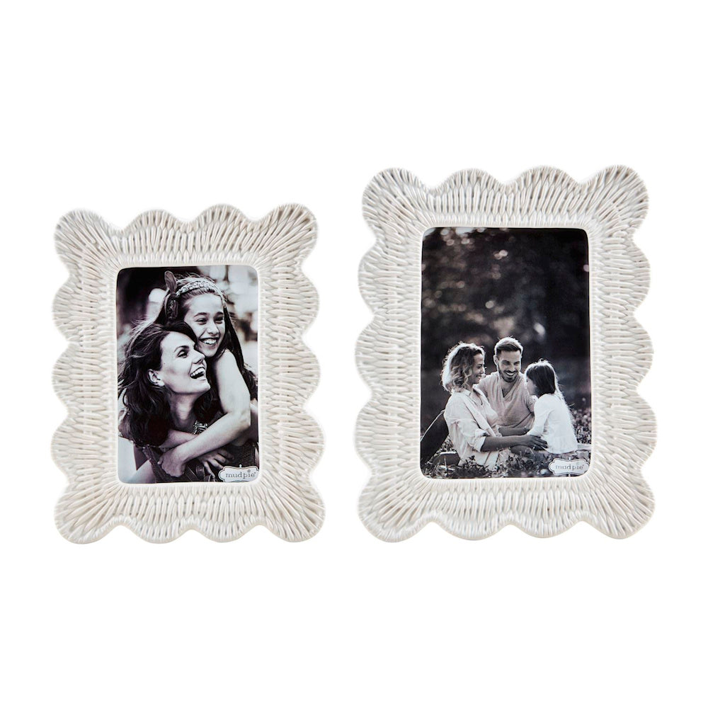 Two Mud Pie white stoneware picture frames with scalloped edges and woven wicker texture holding black and white photos.
