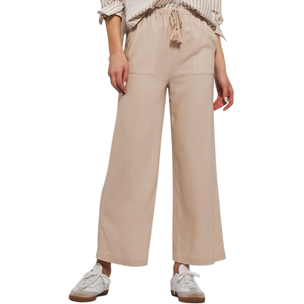 Beige wide-leg pants with an elastic waistband, tassel drawstring, and front pockets, paired with sneakers.