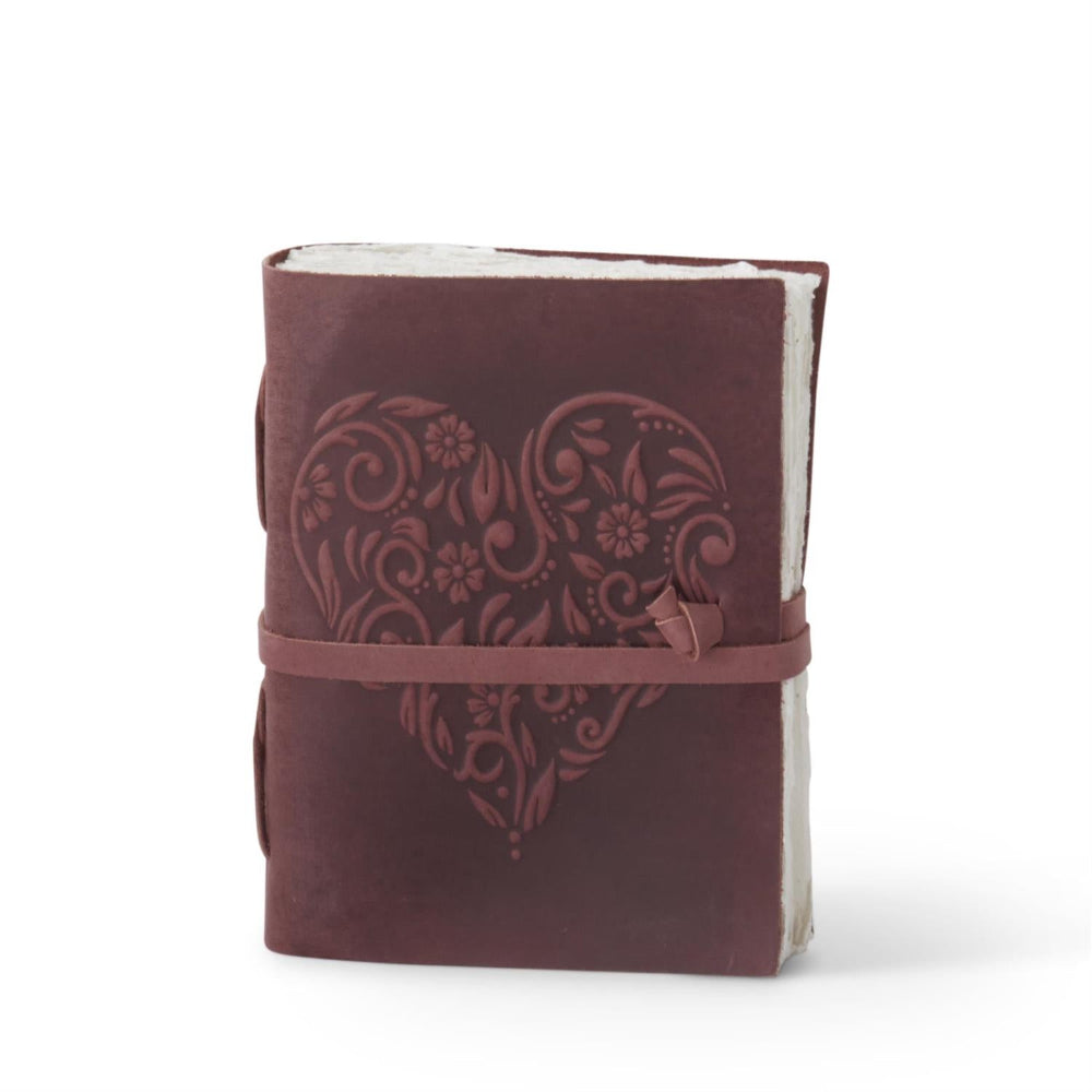 Wine leather handcrafted journal with embossed floral heart design, deckle edge paper, and wrap-around tie closure.