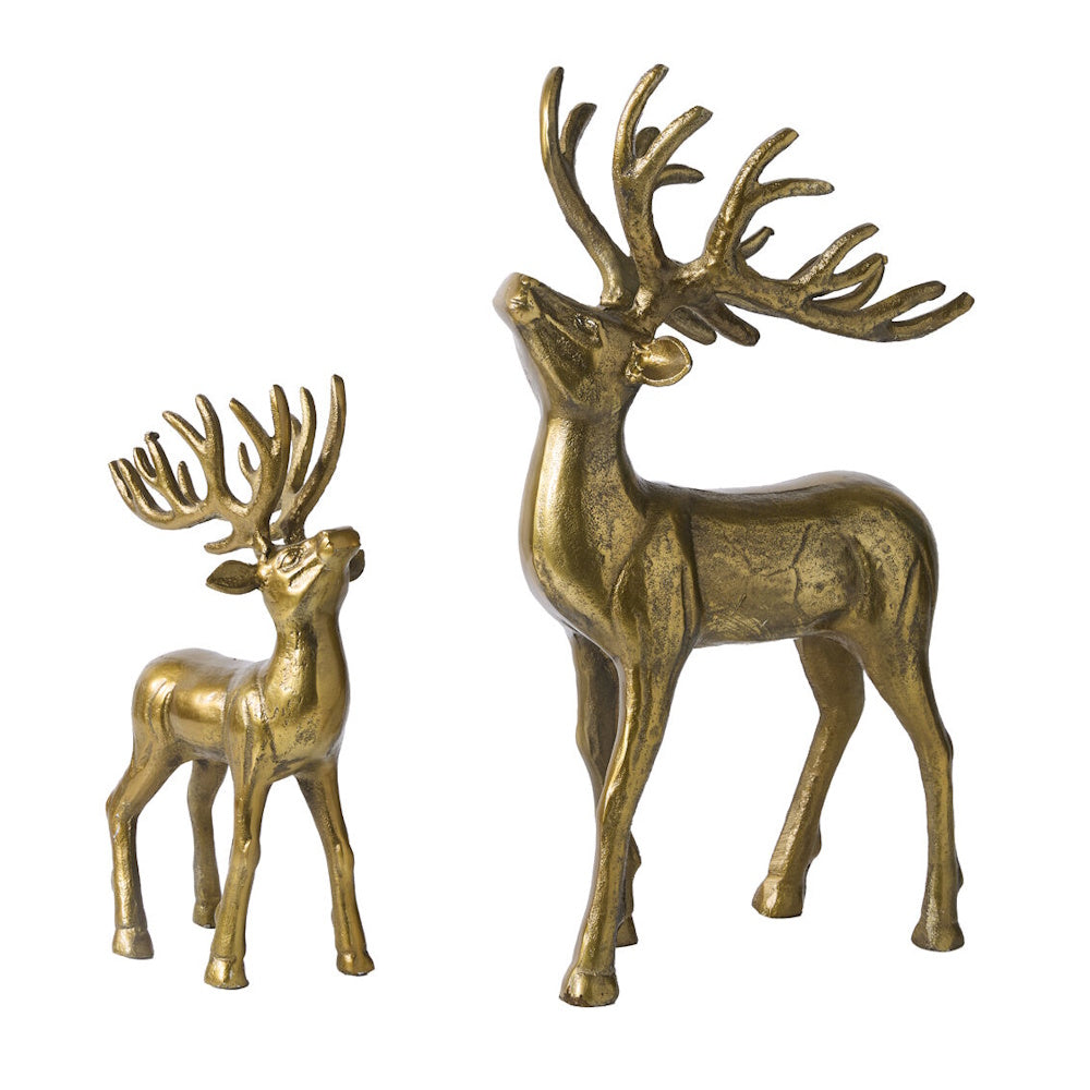 Two gold reindeer figurines of different sizes standing side by side against a white background.
