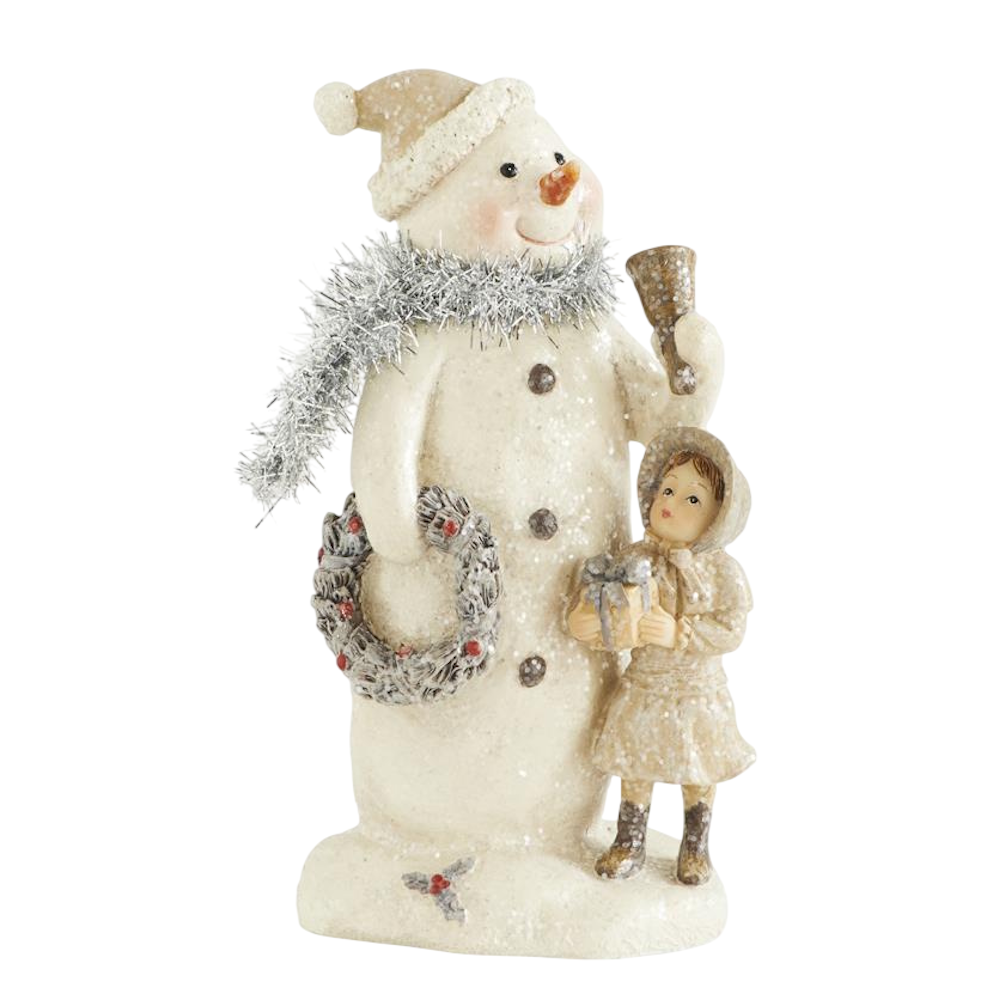 Front view of a cream resin vintage snowman figurine with a silver tinsel scarf and a girl holding a gift.