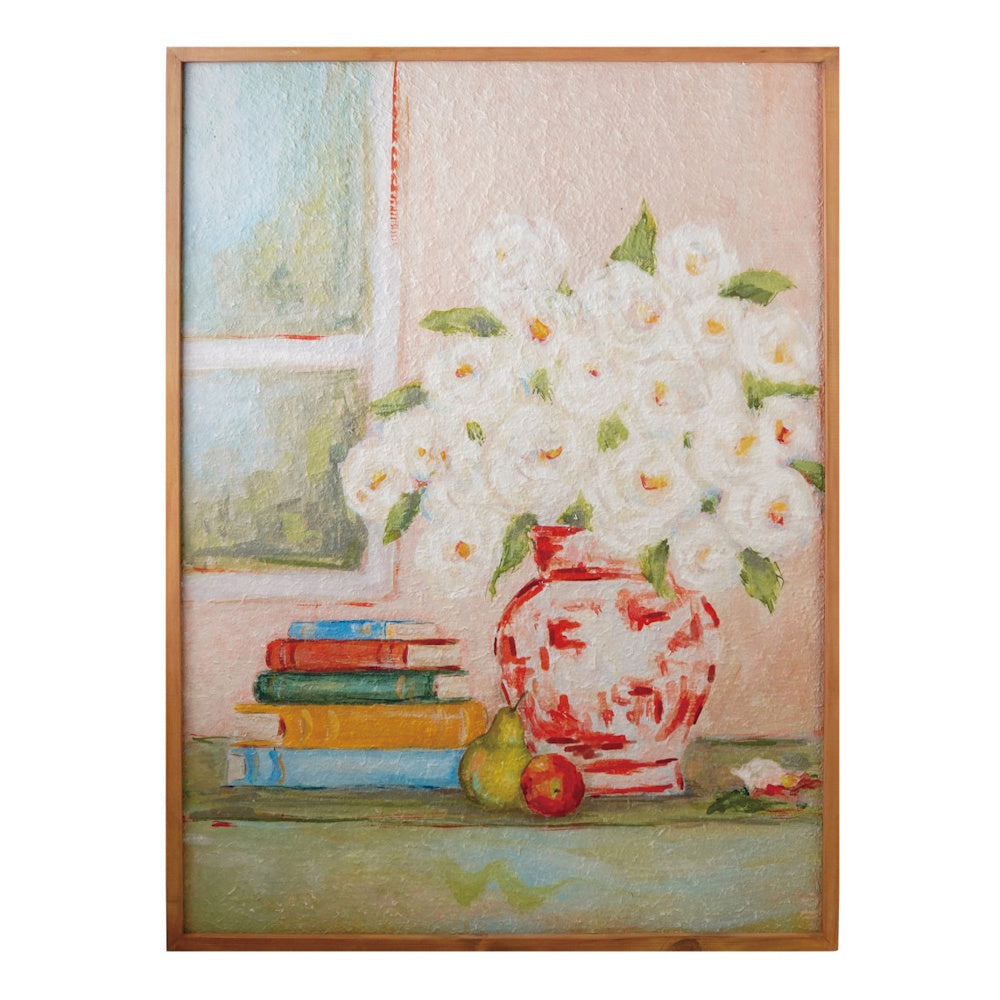 Impressionist painting of white flowers in a patterned red vase, stacked books, and fruit by a window.