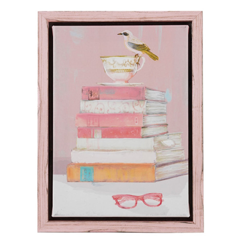 Hand-painted canvas wall art featuring a bird on a teacup atop a stack of books with pink glasses in a wood frame.