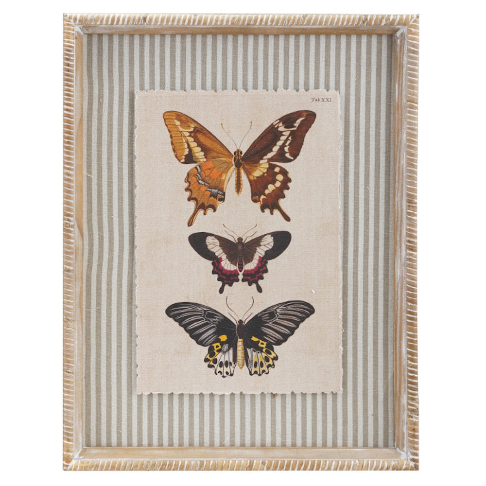 Vintage-style butterfly wall art in a rustic wood frame with a beige and white striped fabric matting background.
