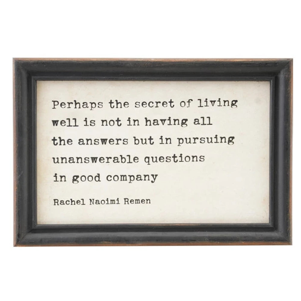 Framed wall decor with a Rachel Naomi Remen quote about living well and pursuing questions in good company.