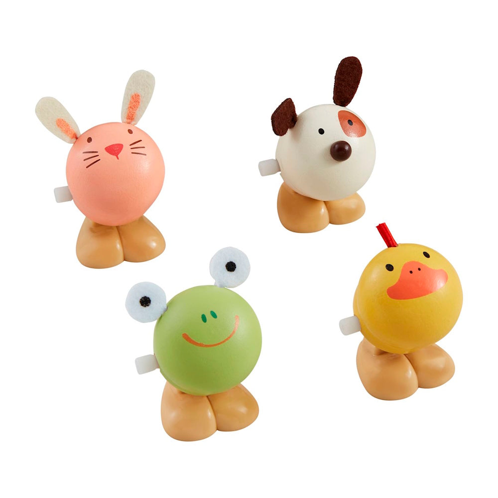 Four colorful round wooden wind-up toys featuring a pink bunny, white dog, green frog, and yellow duck on a white background.