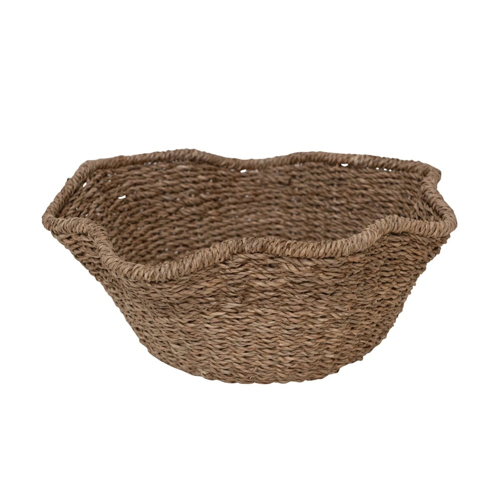 Front view of a brown woven rattan ruffled bowl with a textured natural style.