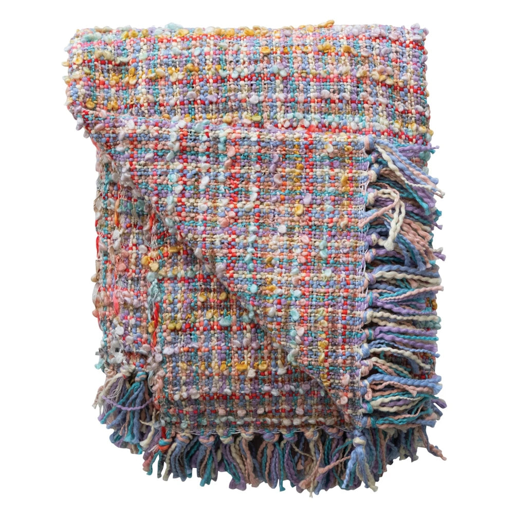 Colorful pastel multi-textured woven throw blanket with fringe trim on white background.