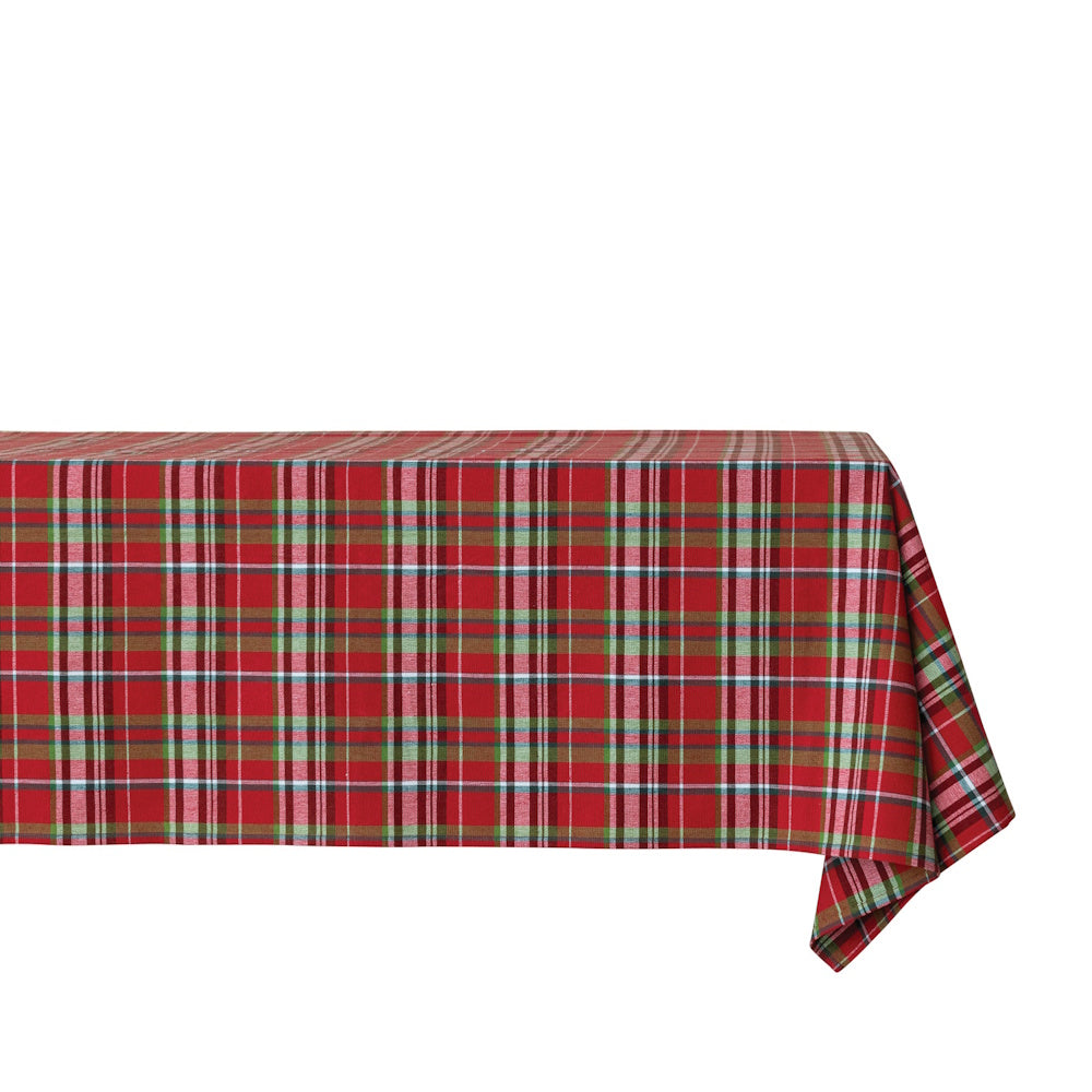 Woven cotton tablecloth featuring a vibrant red tartan plaid pattern draped over a table.