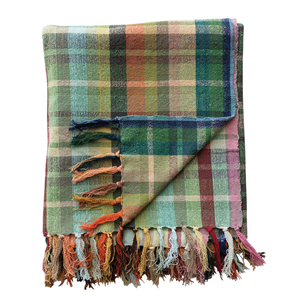 Folded colorful plaid woven cotton throw blanket featuring multi-colored fringe tassels.