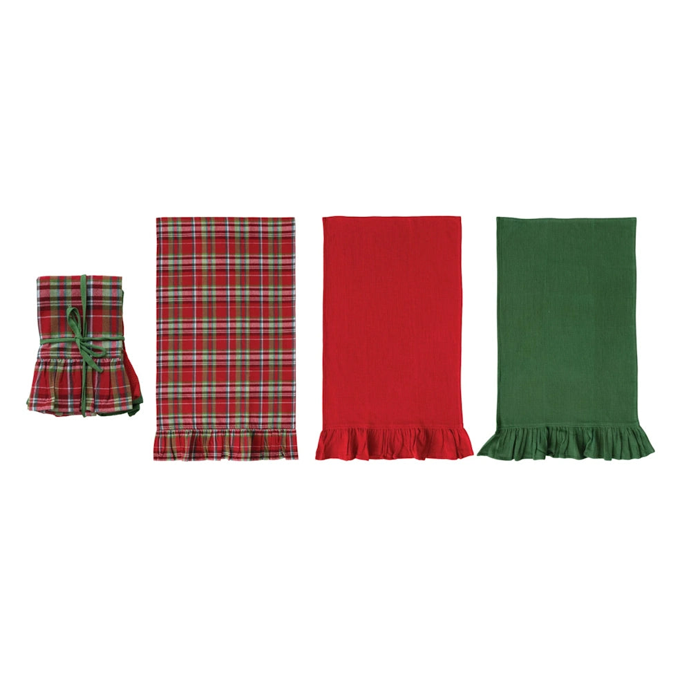 Set of holiday tea towels with ruffled trims including plaid, solid red, solid green, and a tied set.