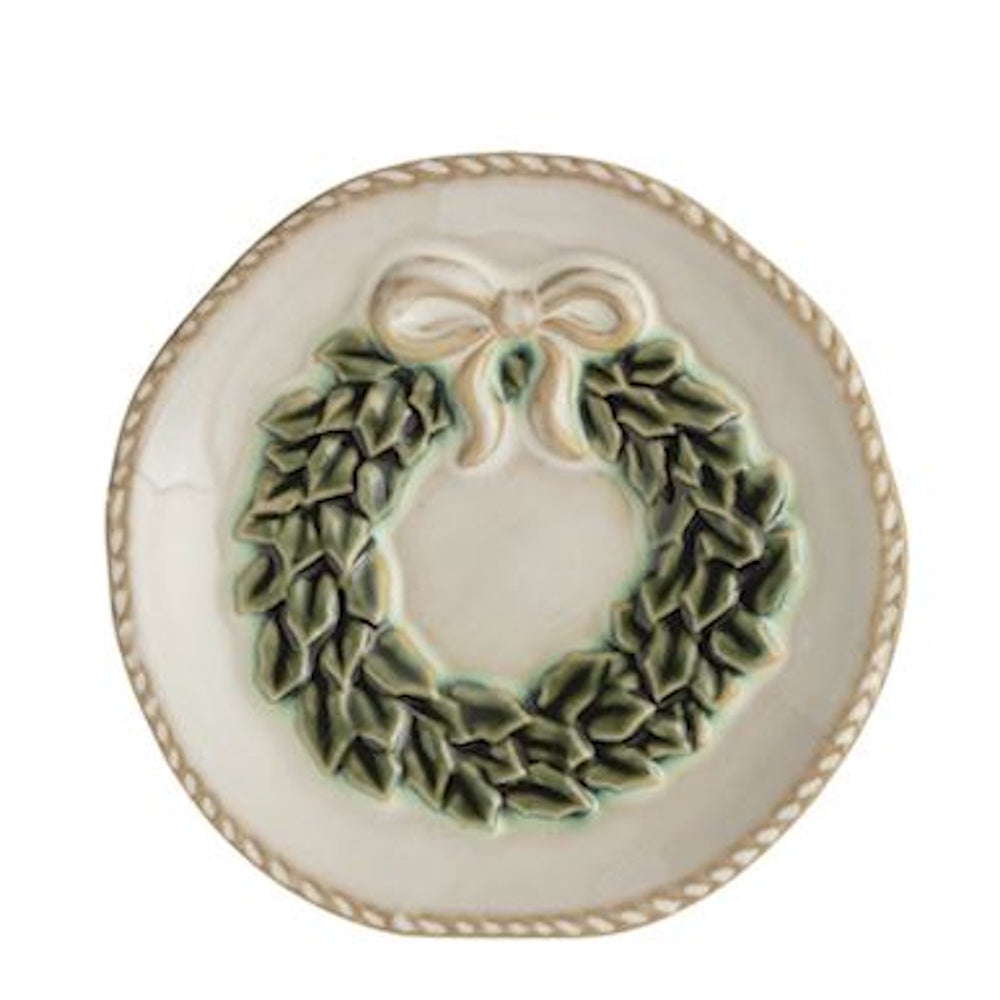 Small white ceramic tidbit plate with an embossed green wreath and cream bow accent.