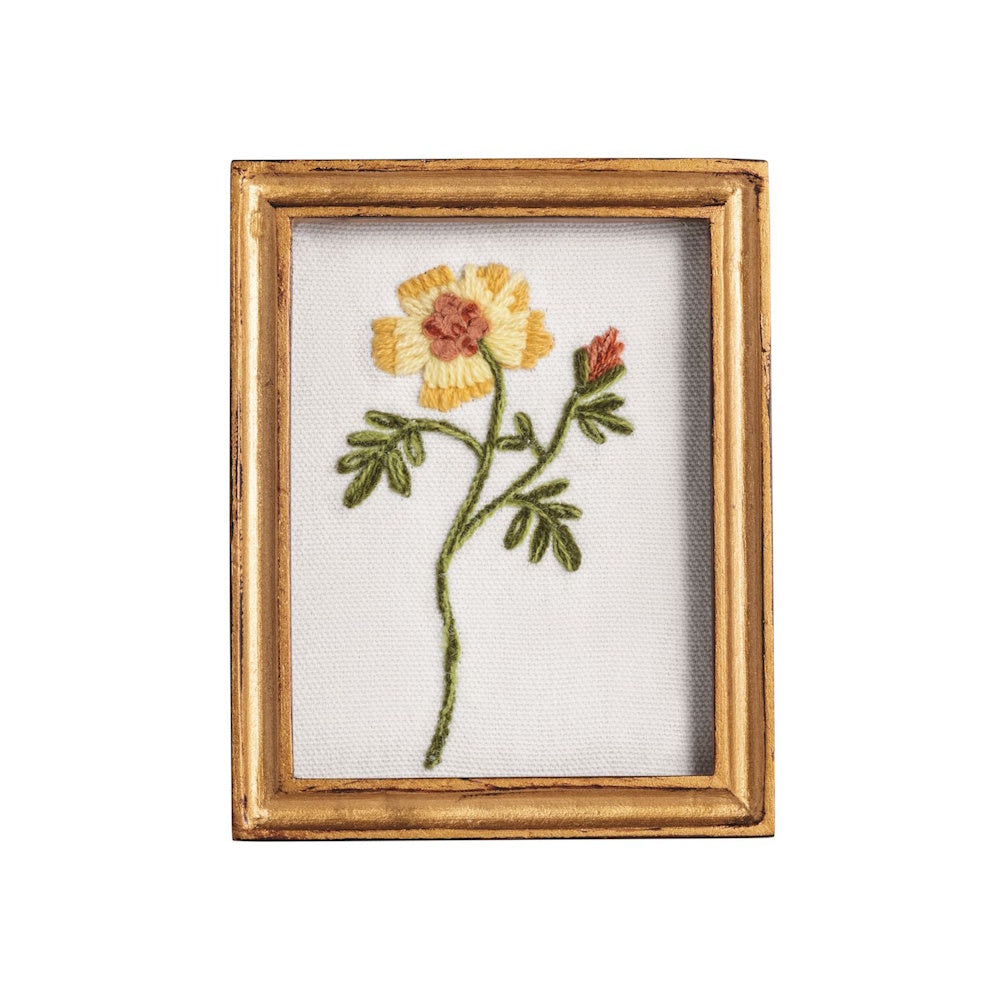 Hand-embroidered yellow flower with green leaves and a small bud, showcased in a vintage-style gold rectangular frame.