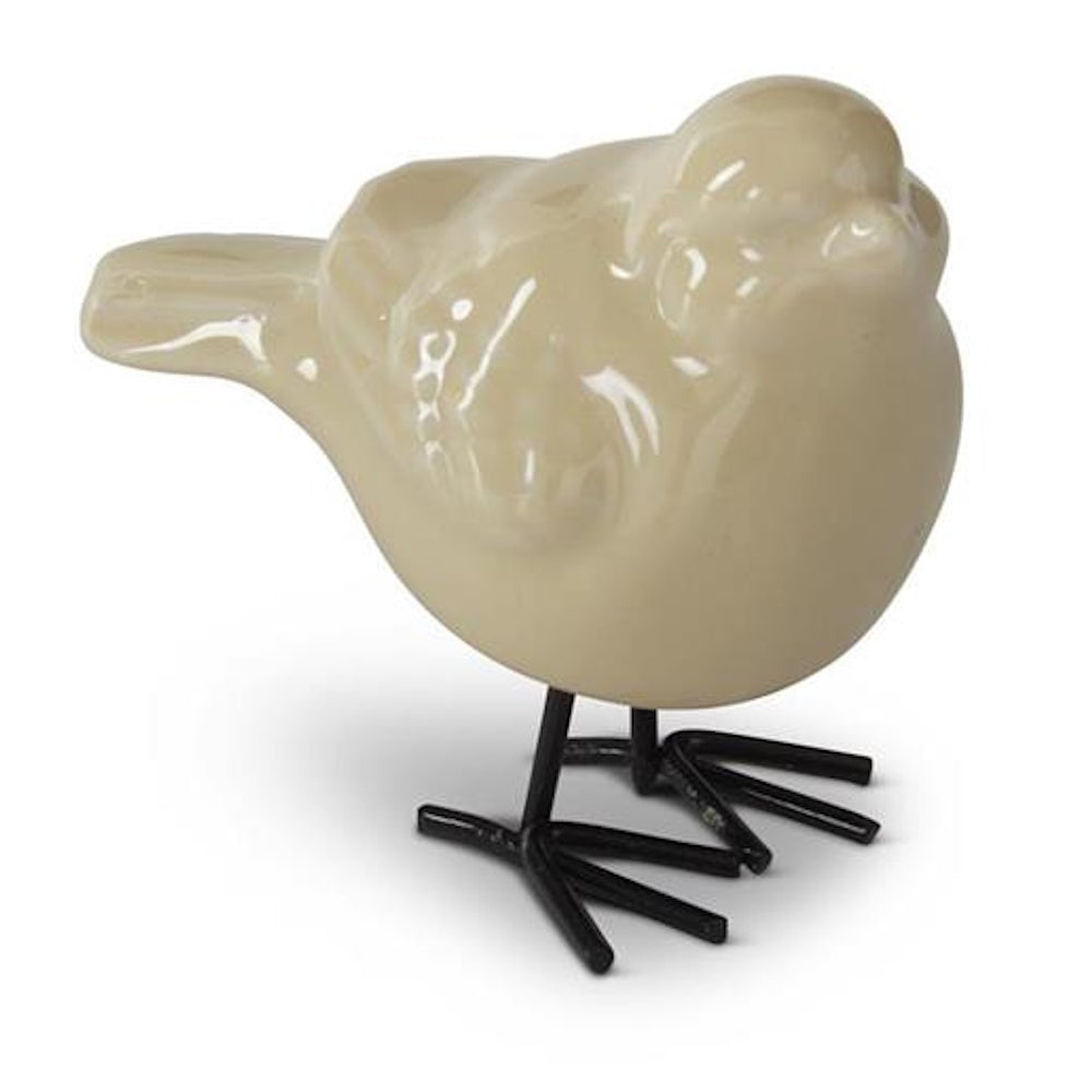 Cream-colored porcelain bird figurine with black metal legs on a white background.