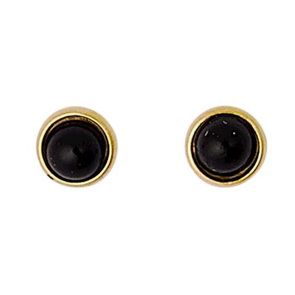 Pair of round black cabochon stud earrings with gold bezel frames on a white background.